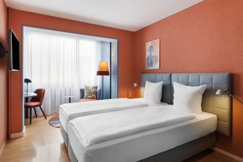 Comfort room twin at Hotel La Pergola featuring two beds and a television in a cozy setting.  